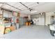 Spacious garage with epoxy flooring, built-in cabinets, and ample storage space for vehicles and equipment at 27467 W Osprey Dr, Buckeye, AZ 85396