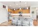 Spacious kitchen with granite counters, stainless appliances, bar seating, and ample cabinetry at 27467 W Osprey Dr, Buckeye, AZ 85396