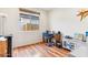 Bright office with a window, wooden desk, comfortable chair, and modern decor at 27467 W Osprey Dr, Buckeye, AZ 85396