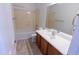 Cozy bathroom features a vanity with sink, a mirror and a bathtub at 29120 N 22Nd Ave # 205, Phoenix, AZ 85085