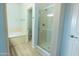 Bright bathroom with glass-enclosed shower, separate toilet room and soaking tub at 29120 N 22Nd Ave # 205, Phoenix, AZ 85085