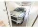 Bright garage featuring a silver pickup truck parked inside with the door open, offering convenient and secure parking at 29120 N 22Nd Ave # 205, Phoenix, AZ 85085