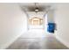 Spacious two car garage with concrete floor and view of adjacent garages across the drive at 29120 N 22Nd Ave # 205, Phoenix, AZ 85085