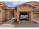 Charming home featuring an attached garage with a vehicle parked inside on a well-maintained brick driveway at 29120 N 22Nd Ave # 205, Phoenix, AZ 85085