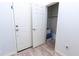 Hallway featuring wood-style flooring with door and closet space at 29120 N 22Nd Ave # 205, Phoenix, AZ 85085