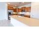 Beautiful kitchen with stainless steel appliances, granite countertops, and wood cabinetry at 29120 N 22Nd Ave # 205, Phoenix, AZ 85085