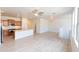 Open-concept living area showcasing wood-style flooring and a spacious kitchen area at 29120 N 22Nd Ave # 205, Phoenix, AZ 85085