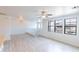Large open living area featuring wood-style floors, neutral walls and natural light at 29120 N 22Nd Ave # 205, Phoenix, AZ 85085
