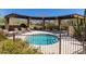 Relaxing hot tub with lounge chairs underneath a shaded pergola, offering scenic mountain views at 29120 N 22Nd Ave # 205, Phoenix, AZ 85085