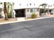 Well-maintained mobile home featuring desert landscaping, covered parking, and charming decorative accents at 303 S Recker Rd # 89, Mesa, AZ 85206