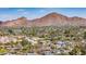 Expansive aerial view of a neighborhood nestled beneath majestic mountains, showcasing the natural beauty and community at 3200 N 39Th St # 4, Phoenix, AZ 85018