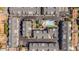 Drone's eye view of townhome community surrounding a serene pool and lush landscaping, showcasing a desirable lifestyle at 3200 N 39Th St # 4, Phoenix, AZ 85018
