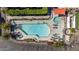Overhead view of the community pool with hot tub, seating and manicured landscaping at 3200 N 39Th St # 4, Phoenix, AZ 85018
