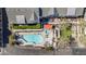 Aerial view showcases the pool and hot tub area with lounge seating, cabana and green foliage at 3200 N 39Th St # 4, Phoenix, AZ 85018