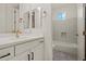 Bright bathroom featuring modern white cabinets, a gold faucet, and a subway-tiled shower/tub combo at 3200 N 39Th St # 4, Phoenix, AZ 85018