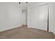 Carpeted bedroom featuring a ceiling fan, and a closet with sliding doors at 3200 N 39Th St # 4, Phoenix, AZ 85018