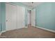 Bedroom with cool color walls, a closet, and neutral-colored carpeting at 3200 N 39Th St # 4, Phoenix, AZ 85018