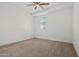 Neutral bedroom with ceiling fan, window with privacy blind and carpeted floors at 3200 N 39Th St # 4, Phoenix, AZ 85018