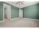 Large green bedroom with multiple doors provides ample space and options at 3200 N 39Th St # 4, Phoenix, AZ 85018