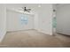 Spacious carpeted bedroom features a ceiling fan and lots of natural light from the window at 3200 N 39Th St # 4, Phoenix, AZ 85018