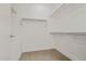 Walk-in closet with ample shelving and storage space, featuring neutral carpet at 3200 N 39Th St # 4, Phoenix, AZ 85018