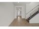 Bright foyer with tile floors, staircase with metal railing and shiplap feature wall at 3200 N 39Th St # 4, Phoenix, AZ 85018
