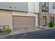 Attached garage and covered entry, showcasing a blend of modern materials and neutral color palette at 3200 N 39Th St # 4, Phoenix, AZ 85018