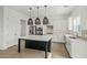 Bright kitchen features a large island with quartz countertop, stainless appliances, and tile backsplash at 3200 N 39Th St # 4, Phoenix, AZ 85018