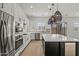 Modern kitchen featuring stainless steel appliances and a large island with quartz countertop at 3200 N 39Th St # 4, Phoenix, AZ 85018