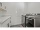 Well-equipped laundry room featuring modern, stainless steel washer and dryer units and ample cabinet space at 3200 N 39Th St # 4, Phoenix, AZ 85018