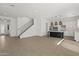 Spacious living area featuring tile floors, staircase, open to dining and kitchen at 3200 N 39Th St # 4, Phoenix, AZ 85018
