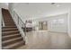 Open-concept living space with tile floors, staircase, and a seamless flow to the kitchen at 3200 N 39Th St # 4, Phoenix, AZ 85018