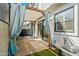 Private outdoor patio with a pergola, privacy curtains, and brick pavers at 3200 N 39Th St # 4, Phoenix, AZ 85018