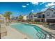 Inviting community pool surrounded by well-maintained townhomes and lush landscaping, creating a serene and appealing outdoor space at 3200 N 39Th St # 4, Phoenix, AZ 85018