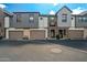 Charming townhomes showcasing a blend of modern design with gray siding and private garages at 3200 N 39Th St # 4, Phoenix, AZ 85018