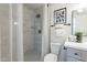 Tastefully remodeled bathroom featuring a tiled shower, gray vanity, and coordinated fixtures for a spa-like experience at 3207 W Royal Palm Rd, Phoenix, AZ 85051
