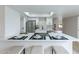 Bright kitchen with an island bar and stainless steel appliances and skylight at 3207 W Royal Palm Rd, Phoenix, AZ 85051