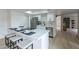 Contemporary kitchen featuring a breakfast bar, white cabinets, and stainless steel appliances and dining area at 3207 W Royal Palm Rd, Phoenix, AZ 85051