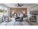 Bright living room with modern furniture, stylish décor, and a paneled accent wall at 3207 W Royal Palm Rd, Phoenix, AZ 85051