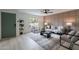 Inviting living room with paneled wall, stylish seating, a large window, and a green door at 3207 W Royal Palm Rd, Phoenix, AZ 85051