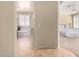 Inviting hallway view leading to a luxurious bathroom and a serene bedroom, showcasing seamless home design at 3285 E Phelps St, Gilbert, AZ 85295