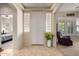 Bright entryway featuring neutral walls, tile flooring, and a glass block accent at 3285 E Phelps St, Gilbert, AZ 85295
