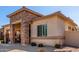 Beautiful home showcasing a stone-accented facade, lush front landscaping, and a well-maintained exterior at 3285 E Phelps St, Gilbert, AZ 85295