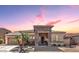 Charming single-story home features a stone facade, desert landscaping, and inviting entry way at 3285 E Phelps St, Gilbert, AZ 85295