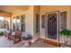 Inviting porch with seating area, decorative accents, and a welcoming entrance at 3285 E Phelps St, Gilbert, AZ 85295
