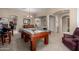 Spacious game room featuring a pool table, neutral walls, and carpeted floors at 3285 E Phelps St, Gilbert, AZ 85295