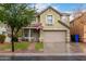 Charming two-story home featuring a covered porch and well-maintained front lawn at 3432 E Bartlett Dr, Gilbert, AZ 85234