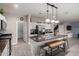 Modern kitchen featuring stainless steel appliances, mosaic backsplash, and a large island at 3432 E Bartlett Dr, Gilbert, AZ 85234