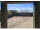 The backyard features a view of neighboring houses and a block wall at 36905 W Mattino Ln, Maricopa, AZ 85138