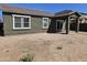 The backyard features a covered patio, potential for outdoor living and entertaining at 36905 W Mattino Ln, Maricopa, AZ 85138